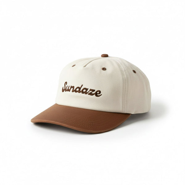 Beige and brown cap with 'Sundaze' embroidery on a white background