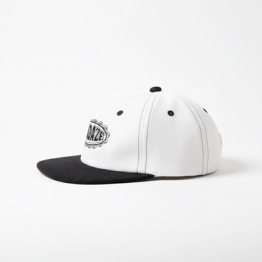 White and black cap with 'Sundaze' logo on a white background