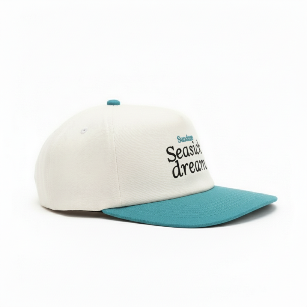Cap with 'Seasick dream' text and Sundaze logo on a white background