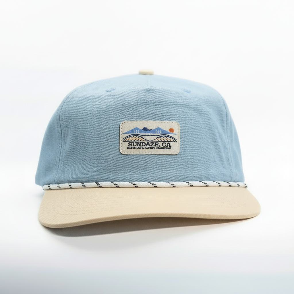Light blue and beige cap with a patch on a white background