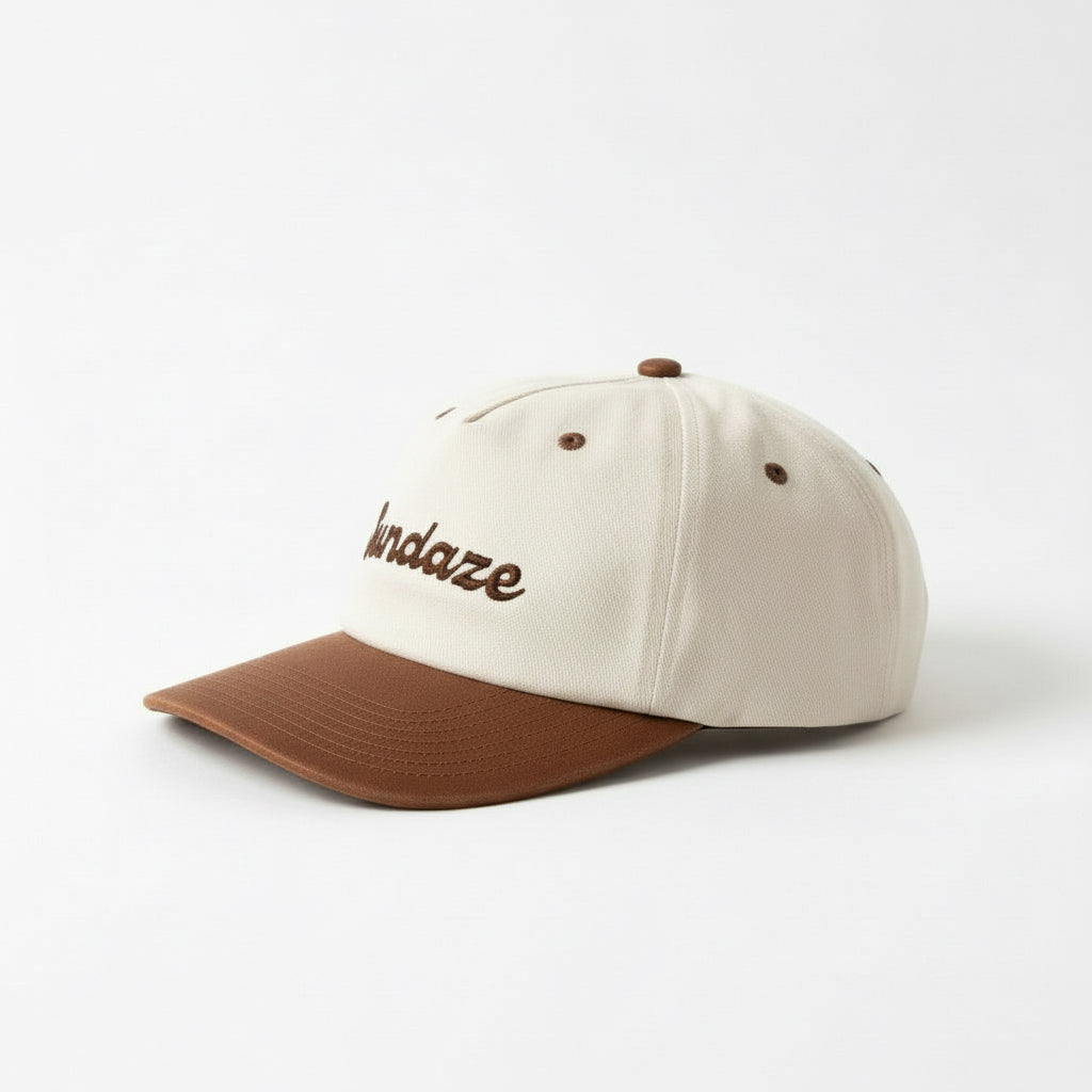 Beige and brown cap with 'Sundaze' embroidery on a white background